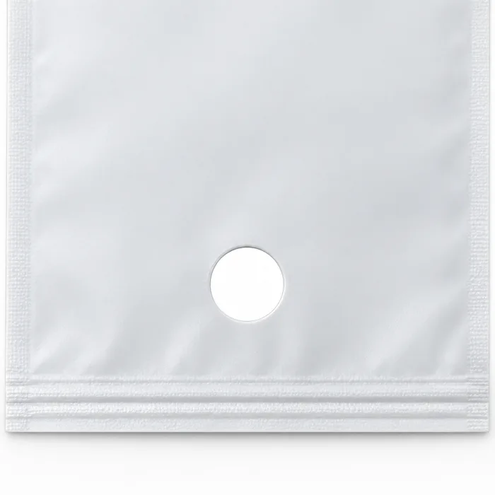 A one-way degassing valve fitted to the face of a coffee pouch