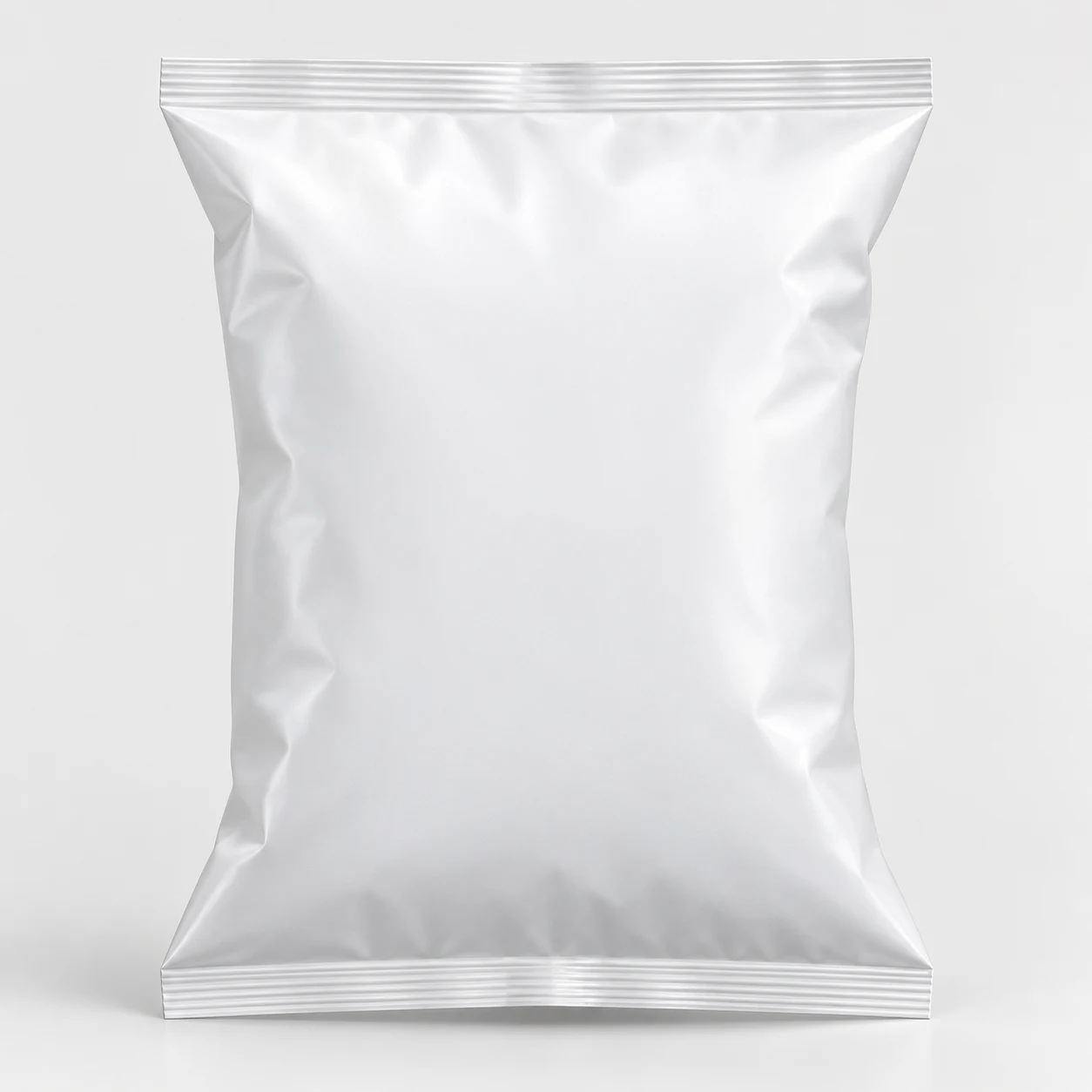 Back-seal pillow pouch in matt white film, unfilled, seen from the front